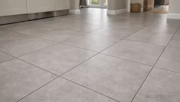 Ceramic and porcelain tiled floor with even grout colour and a consistent, residue-free surface