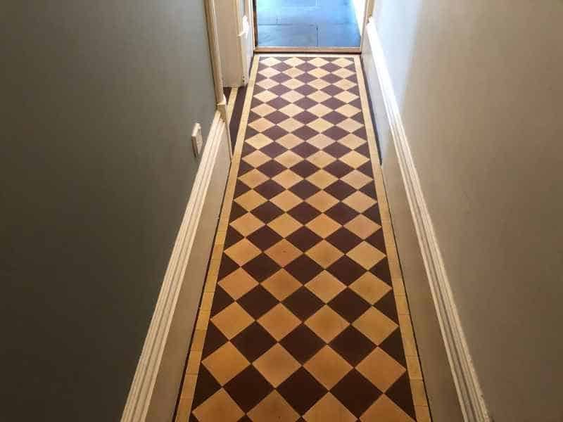 Decorative Edwardian clay tile floor showing restored pattern after cleaning in Burton upon Trent