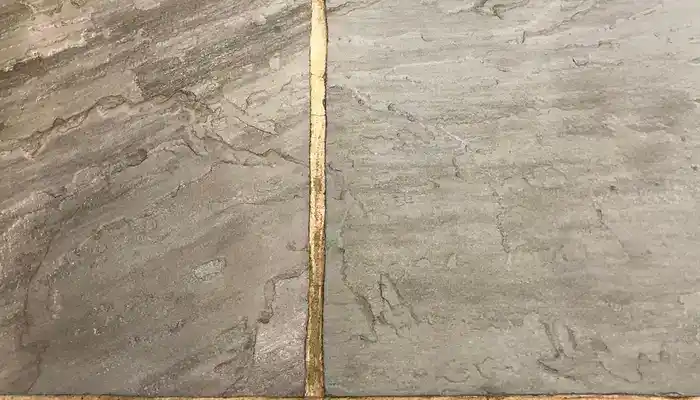 Close-up of riven slate showing raised texture, layers and natural surface variation